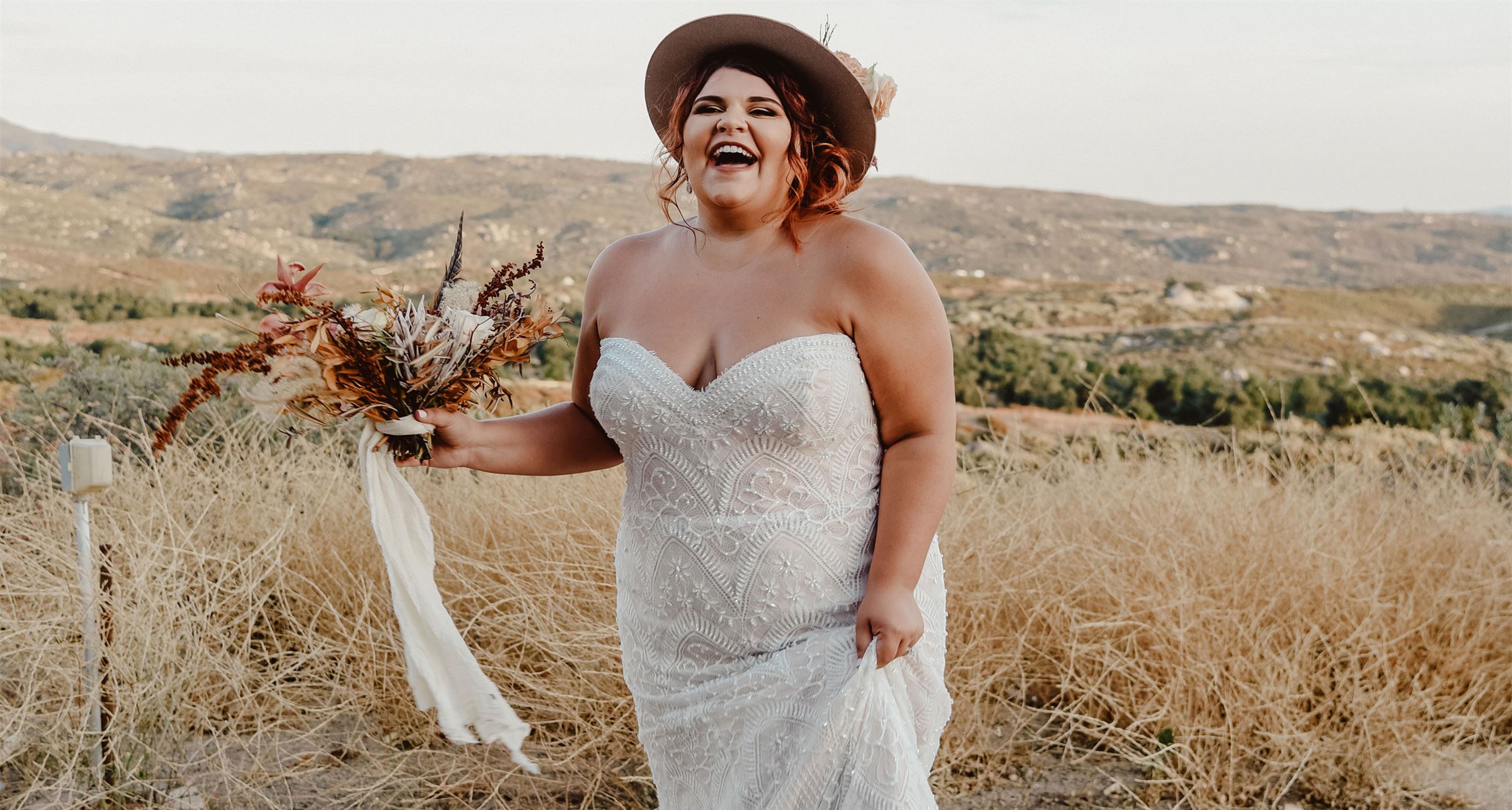 Plus size bride in white dress on countryside. Desktop Image